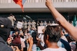 Protestors gather at the entrance to the Federal Bulding to denounce ICE detentions in Los Angeles, Monday, June 9, 2025. President Trump thinks it is a sign of strength to send in troops to deal with protesters in Los Angeles. (Daniel Terna/The New York Times)