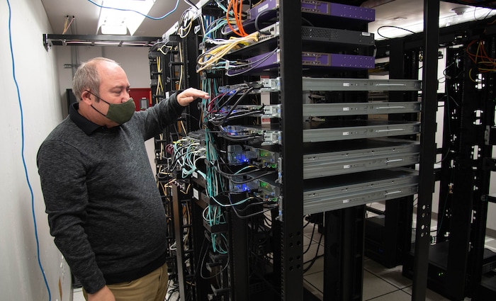 (Francisco Kjolseth  | The Salt Lake Tribune) Jason Eyre, coordinator for the technology department for the Murray School District, visits the server room as he discusses the unveiling of its own LTE network to better help students connect during their online schooling with the pandemic.
