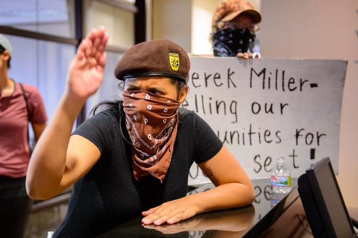 (Trent Nelson  |  The Salt Lake Tribune) Inland Port protesters occupy the Chamber of Commerce office in Salt Lake City on Tuesday, July 9, 2019.