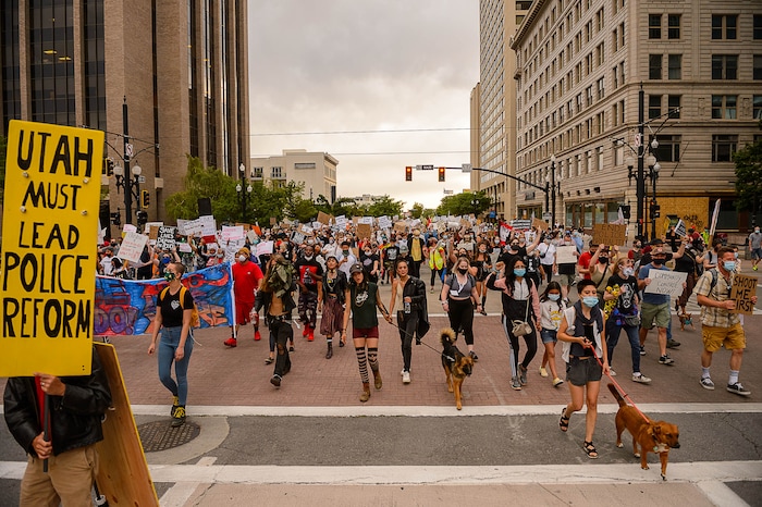 (Trent Nelson  |  The Salt Lake Tribune) People march against police brutality in Salt Lake City on Saturday, June 13, 2020.
