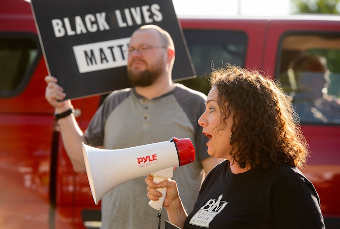 (Trent Nelson  |  The Salt Lake Tribune)
Chelsie Acosta speaks at a protest organized by Black Lives Matter and other groups at the Woods Cross Police Department on Friday June 14, 2019. The rally was to show support for DJ Hrubes, a 10-year-old black child who was held at gunpoint by a police officer last week while playing in his grandmother's front yard.