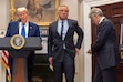 President Donald Trump, from left, speaks as Health and Human Services Secretary Robert F. Kennedy Jr. puts his cellphone away and Dr. Mehmet Oz, administrator of the Centers for Medicare & Medicaid Services checks his cellphone during an event in the Roosevelt Room at the White House, Monday, May 12, 2025, in Washington. (AP Photo/Mark Schiefelbein)