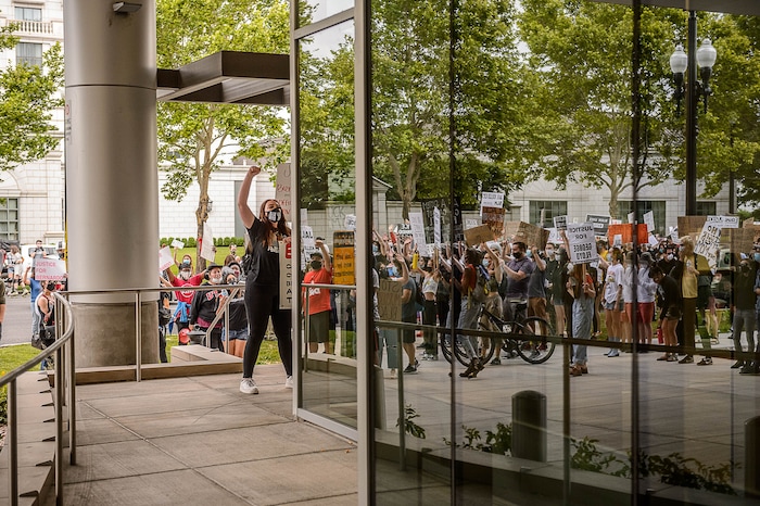 (Trent Nelson  |  The Salt Lake Tribune) People gather at the Salt Lake County District Attorney's office to protest against police brutality in Salt Lake City on Saturday, June 13, 2020.