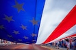 (Trent Nelson  |  The Salt Lake Tribune) A large flag is carried down University Avenue at the Grand Parade for America’s Freedom Festival in Provo on Friday, July 4, 2025.