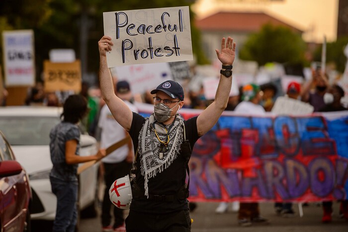 (Trent Nelson  |  The Salt Lake Tribune) People march against police brutality in Salt Lake City on Saturday, June 13, 2020.