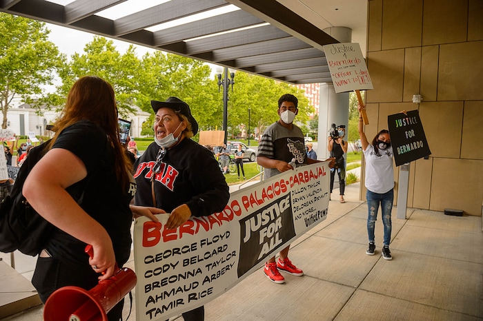 (Trent Nelson  |  The Salt Lake Tribune) People gather at the Salt Lake County District Attorney's office to protest against police brutality in Salt Lake City on Saturday, June 13, 2020.