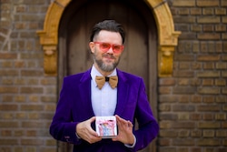 (Trent Nelson  |  The Salt Lake Tribune) Jared Gold is photographed in Salt Lake City on Wednesday, Dec. 13, 2023. He holds a box of his gourmet candy, the Candy Sutra, which is available to purchase.