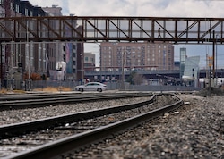 (Francisco Kjolseth  |  The Salt Lake Tribune) A pedestrian bridge spans the railroad tracks at 300 North in Salt Lake City on Thursday, Feb. 8, 2024, just east of the current freeway underpass at 300 North. UDOT and Salt Lake City have proposed an I-15 underpass at 400 North as a part of the highway's expansion, but residents nearby say they don't want it.