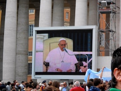 (Erin O'Brien) Pope Francis appears on the big screen in St. Peter’s Square during his general audience in April 2013.
