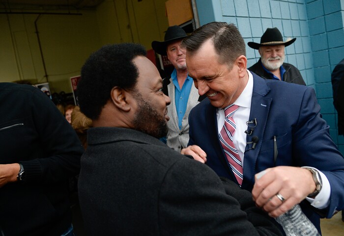 (Francisco Kjolseth  |  The Salt Lake Tribune) Former kickboxing world champion Eddie "Flash" Newman, left, embraces former House Speaker Greg Hughes as Hughes announces his campaign for governor at Dee's Automotive in Murray on Wednesday, Jan. 8, 2020.