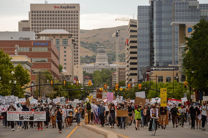 (Trent Nelson  |  The Salt Lake Tribune) People march against police brutality in Salt Lake City on Saturday, June 13, 2020.