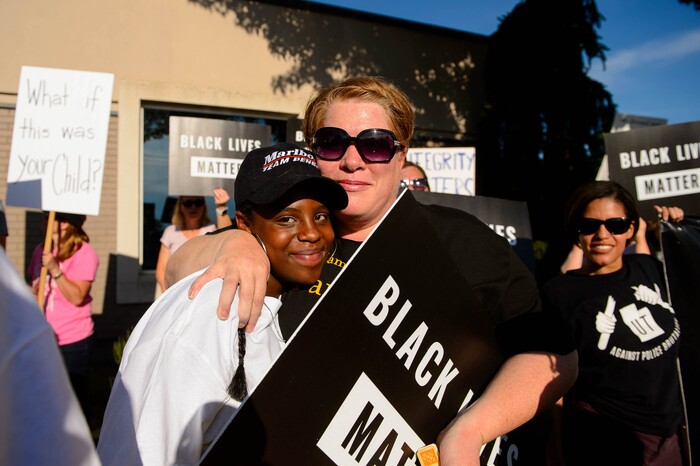 (Trent Nelson  |  The Salt Lake Tribune)
Sophia Beecher is embraced by her mother Susan after speaking at a protest organized by Black Lives Matter and other groups at the Woods Cross Police Department on Friday June 14, 2019. The rally was to show support for DJ Hrubes, a 10-year-old black child who was held at gunpoint by a police officer last week while playing in his grandmother's front yard.