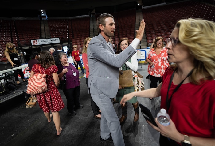 (Francisco Kjolseth | The Salt Lake Tribune) Carson Jorgensen gives high fives after it is announced that he is the new Utah Republican Chairman following long awaiting voting during the party’s convention at the Maverik Center in West Valley City on Saturday, May 1, 2021.