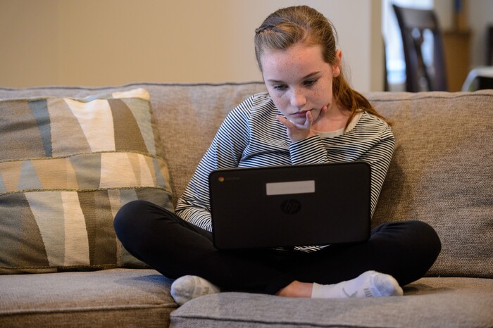 (Trent Nelson  |  The Salt Lake Tribune) Hannah Bowen, a seventh grader at Hillcrest Junior High, does online schoolwork at her home in Murray on Wednesday, Jan. 13, 2021.
