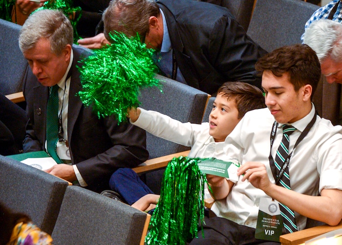 Leah Hogsten  |  The Salt Lake Tribune  l-r Utah Valley University president Astrid Tuminez's husband Jeffery Tolk and sons Leo and Whitman cheer her during her presidential inauguration, becoming UVU's first female president Wednesday. Astrid Tuminez became the university's seventh president, March 27, 2019 and will oversee a campus of over 37,000 students with a top-tier teaching program, a competitive business school and a popular open admissions policy. Born and raised in the Philippines, she has a bachelor's degree from Brigham Young University, a master's degree from Harvard University and a doctorate from Massachusetts Institute of Technology.